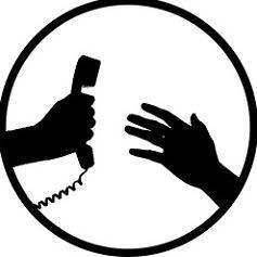 a hand reaching for a phone